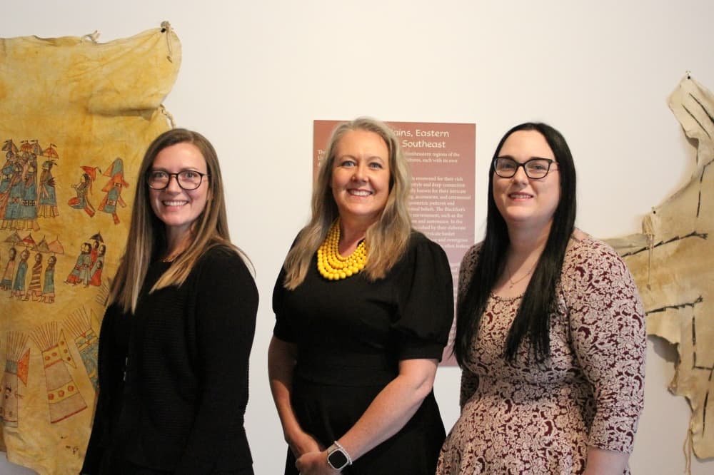 Director of Exhibits and Programming Samantha Aguilar (left), Executive Director Nicole DeGuzman (center) and Director of Education Rebecca Burns
