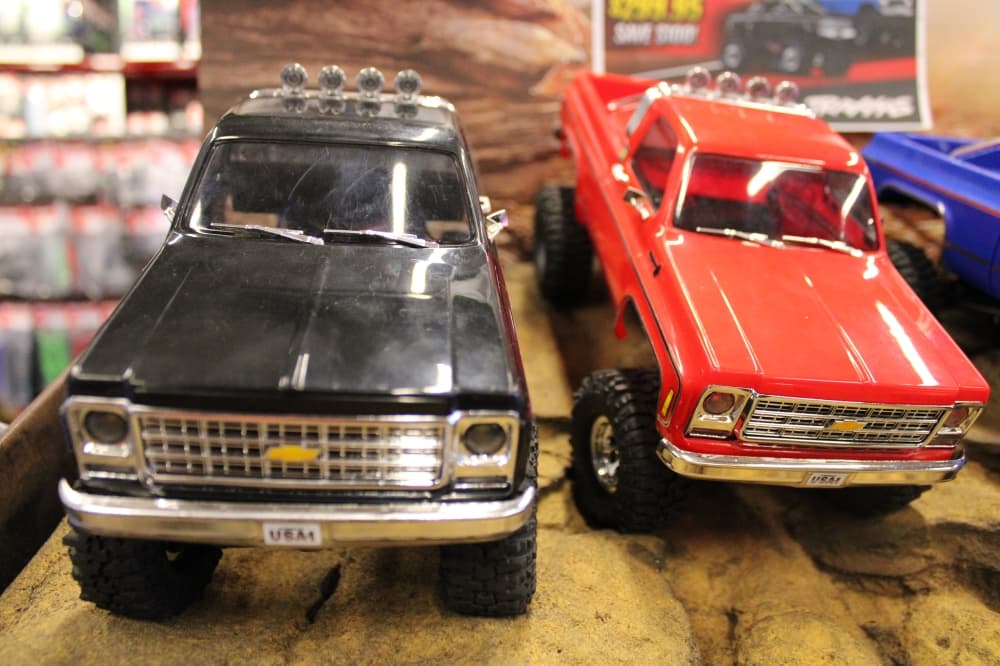 two RC trucks on display