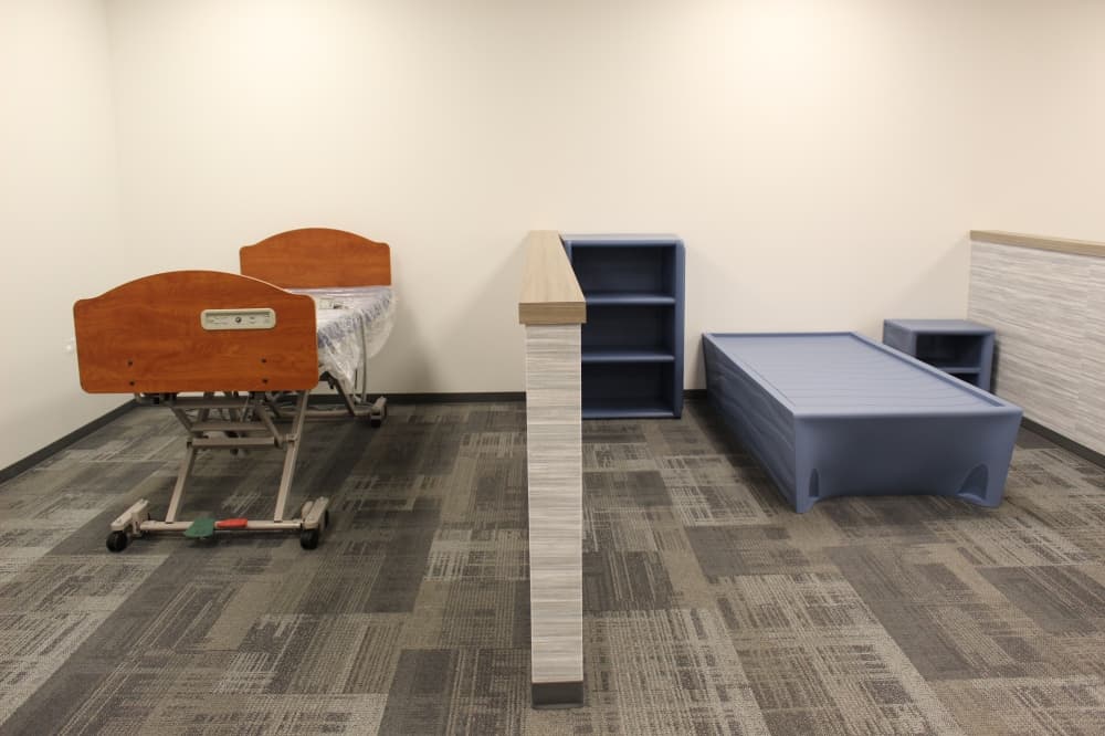 A practice bedroom for making the bed
