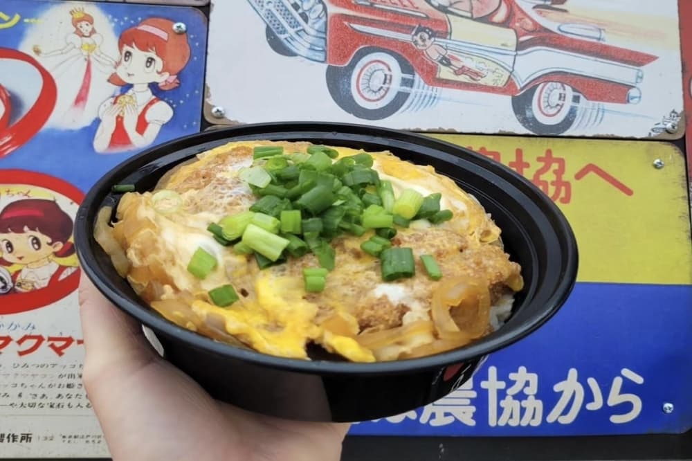 Uncle Buda offers an assortment serves an assortment of rice bowl dishes including Katsudon—which consists of a fried pork cutlet simmered in a sweet dash broth with thinly sliced onion and eggs served over rice and topped with green onion. (Photo courtesy Uncle Buda)