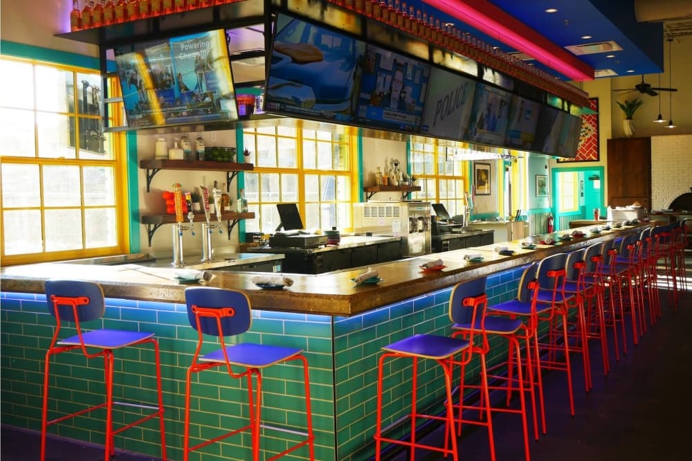 Brightly colored bar and bar stools. 