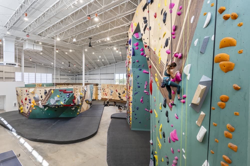 An image of a climber on the 58-foot climbing walls. 