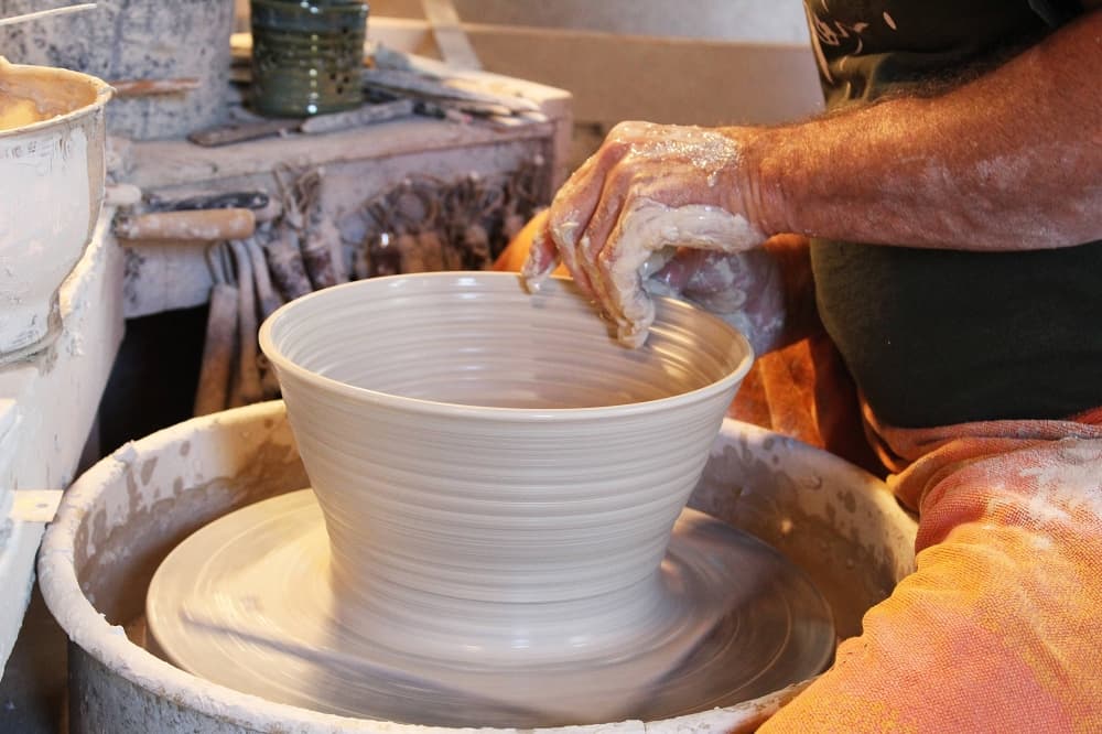 Close up of a pot being made on a potter's wheel. 