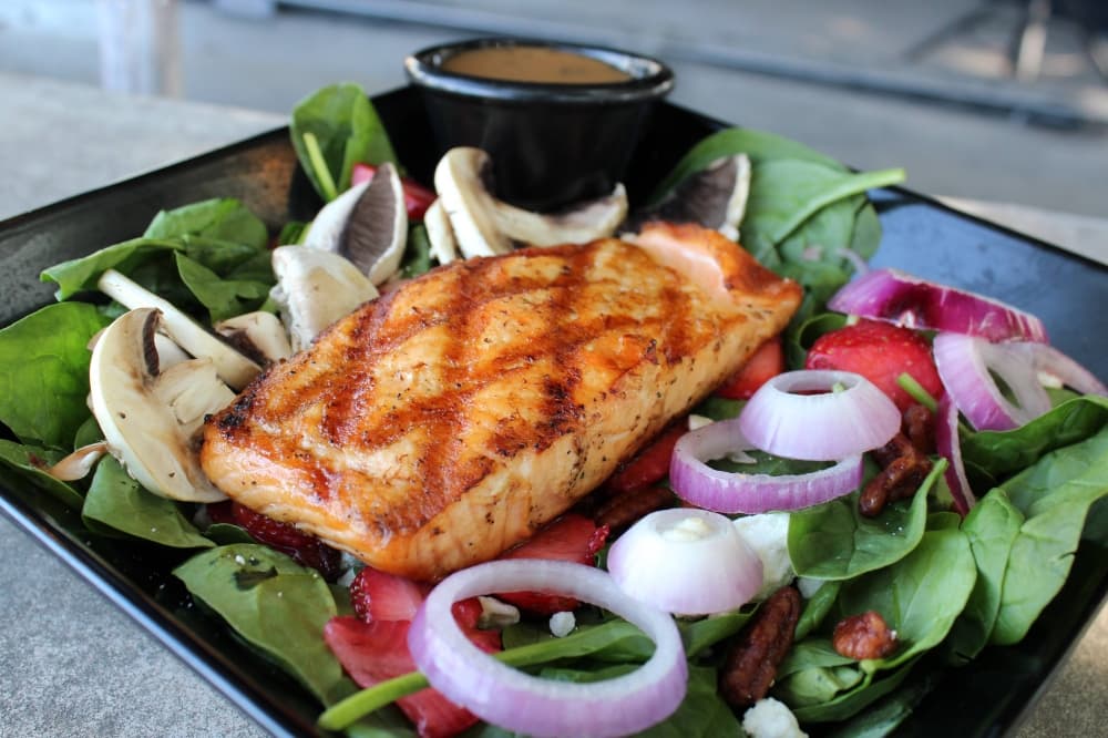 Salad with salmon on top. 