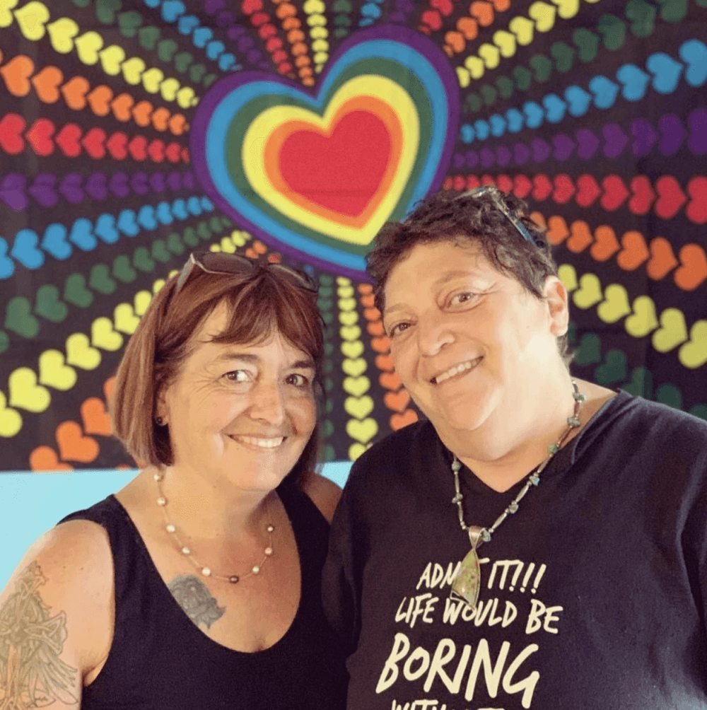 The two women smile for the photo.