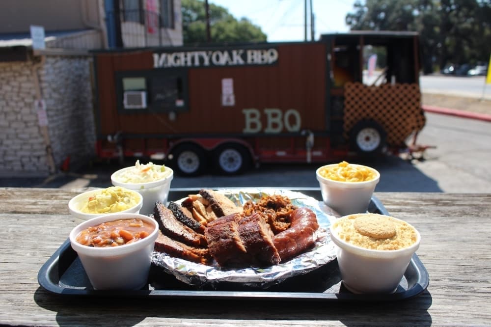 Mighty Oak BBQ offers daily plate specials including a brown bag special containing a choice of meat, side and banana pudding for dessert. (Shaheryar Khan/Community Impact)