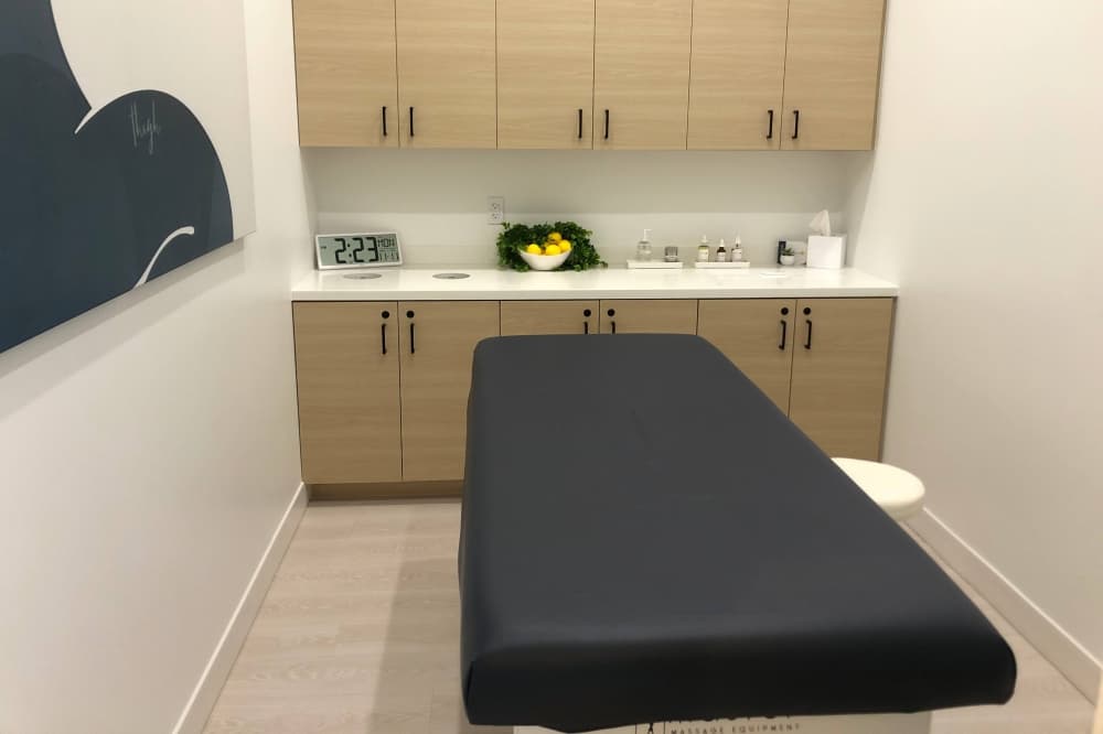 Room with cabinets and flat bed. 