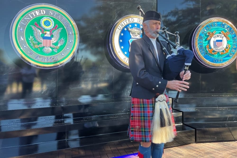 person playing a bagpipe