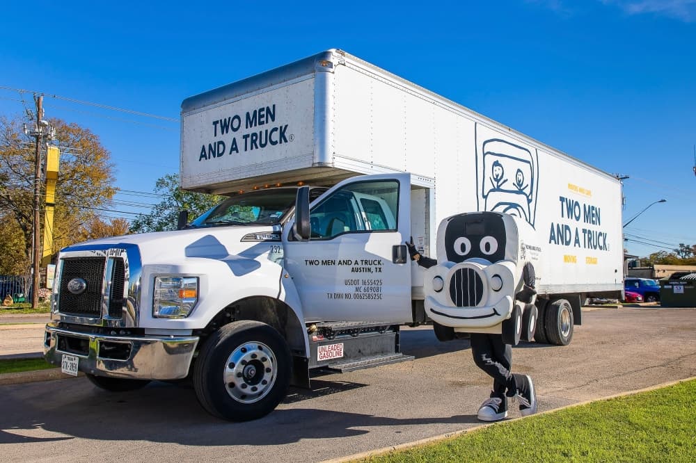 An image of the business' moving truck and mascot. 