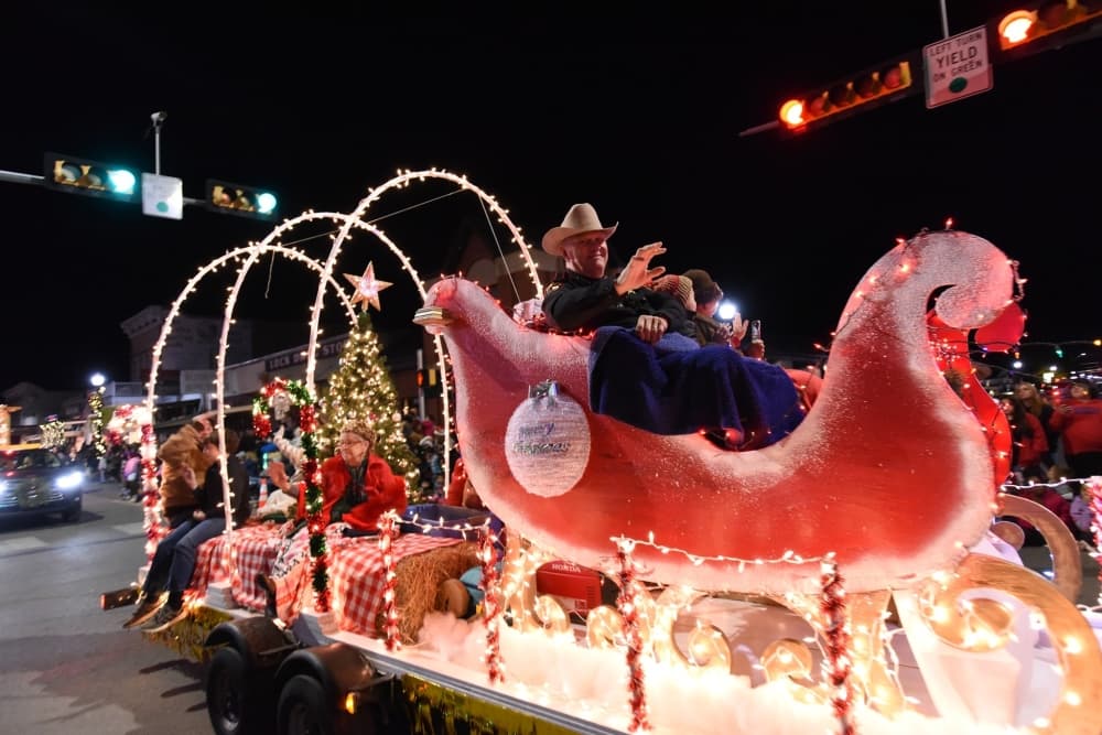 A lighted float is shown decorated for Christmas.