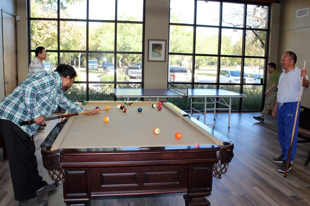 A group of seniors play pool at the Coppell Senior and Community Center. 