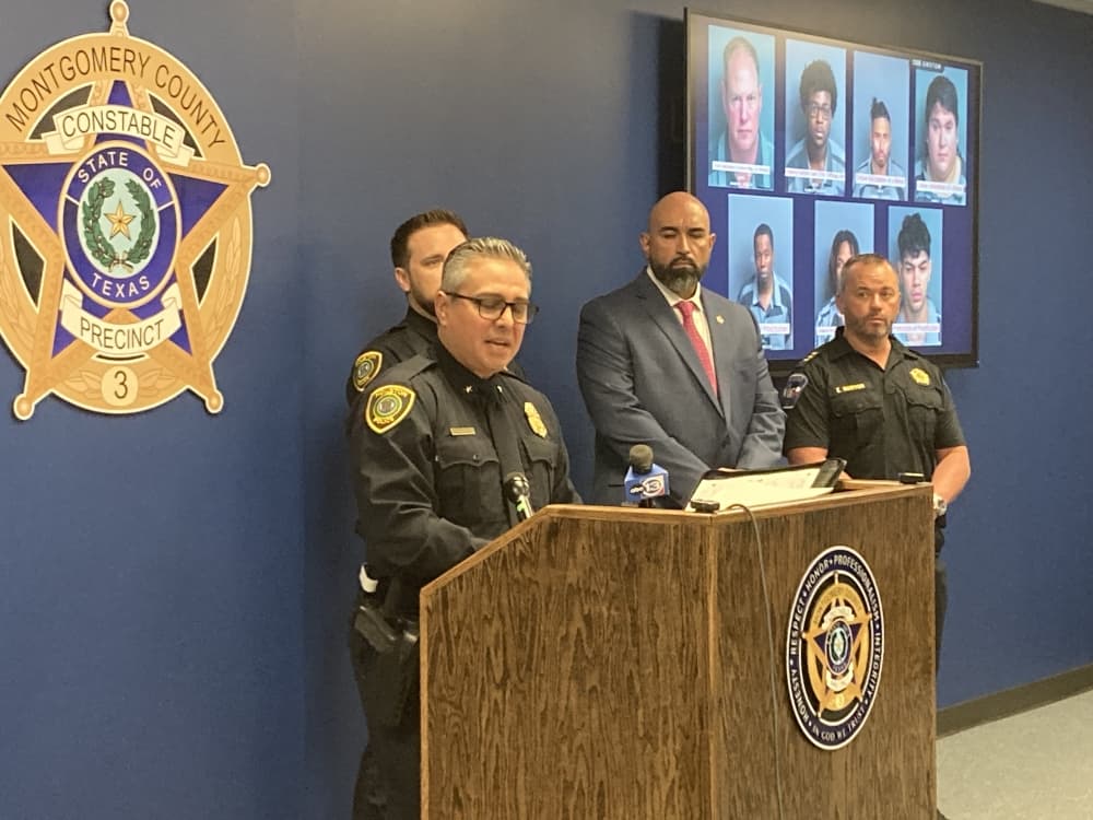 police officer at a podium at a press conference