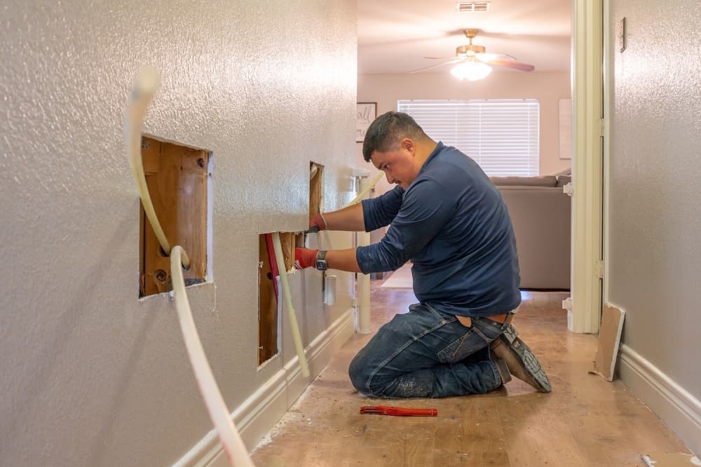 man working on pipes 