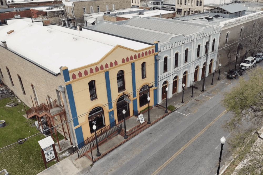 An aerial view of the opera house is shown downtown, along with the building it will expand into.