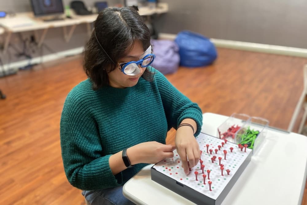 kid using tools for vision therapy 