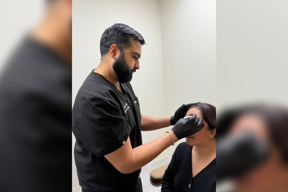 Dr. Sidhu adminstering an injectable