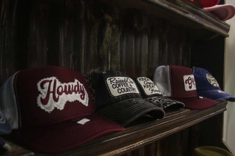 An image of some trucker hats sold at the store. 