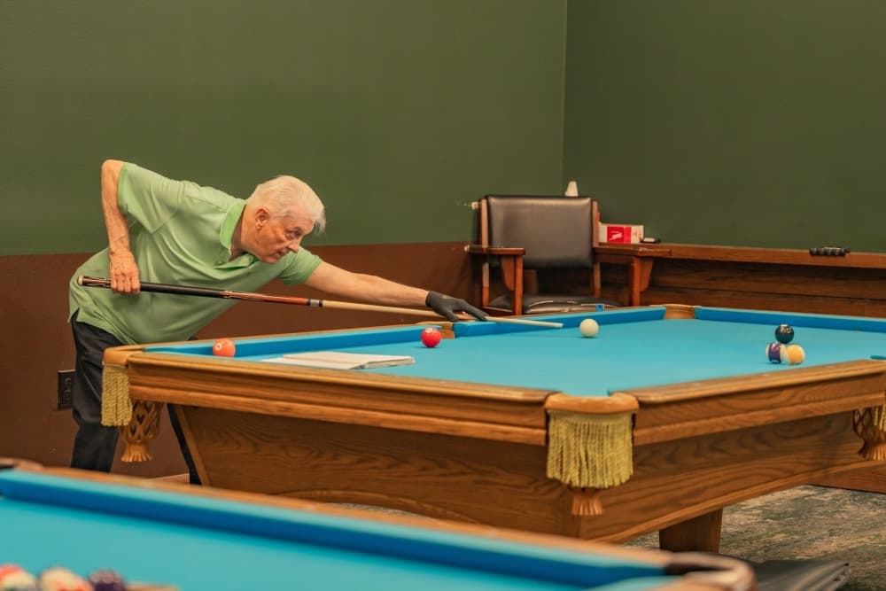 Man playing billiards
