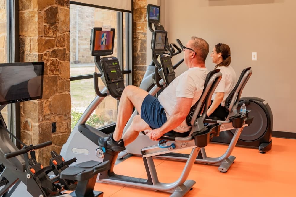 People on exercise machines
