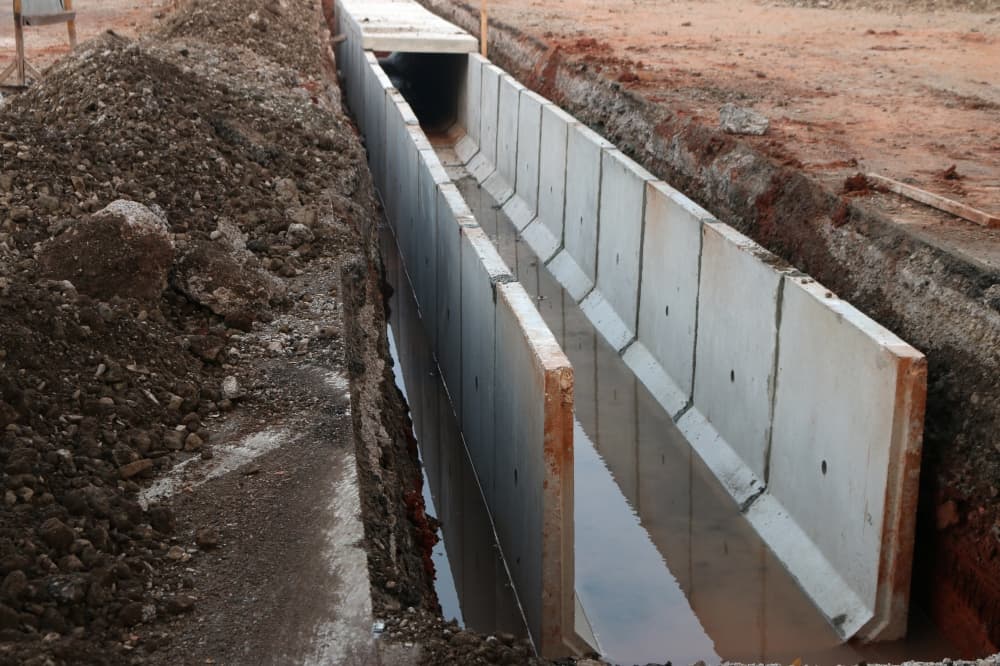 A U-Ditch is a precast concrete drainage channel shaped like the letter "U" commonly used for directing rainwater and other water runoff. (Courtesy Adobe Stock)