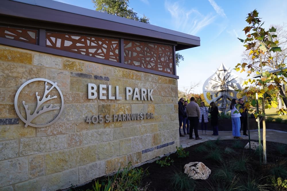A park sign and public art. 