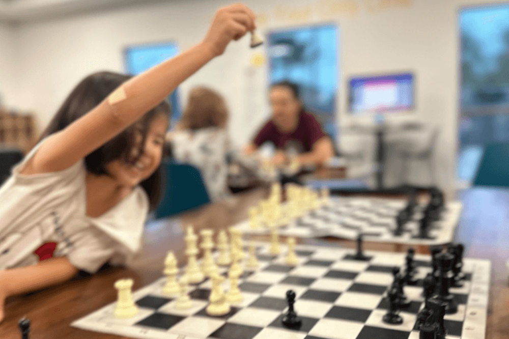 A student plays chess.