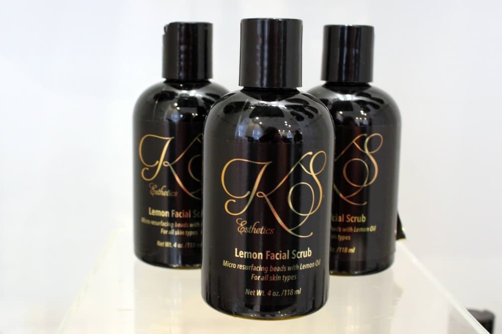 Three bottles of skin care products with K&S branding. 