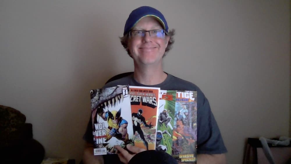 Man holding comic books 