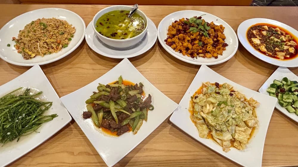 Spicy House Chinese Food presents a table filled with its Sichuan-inspired dishes.