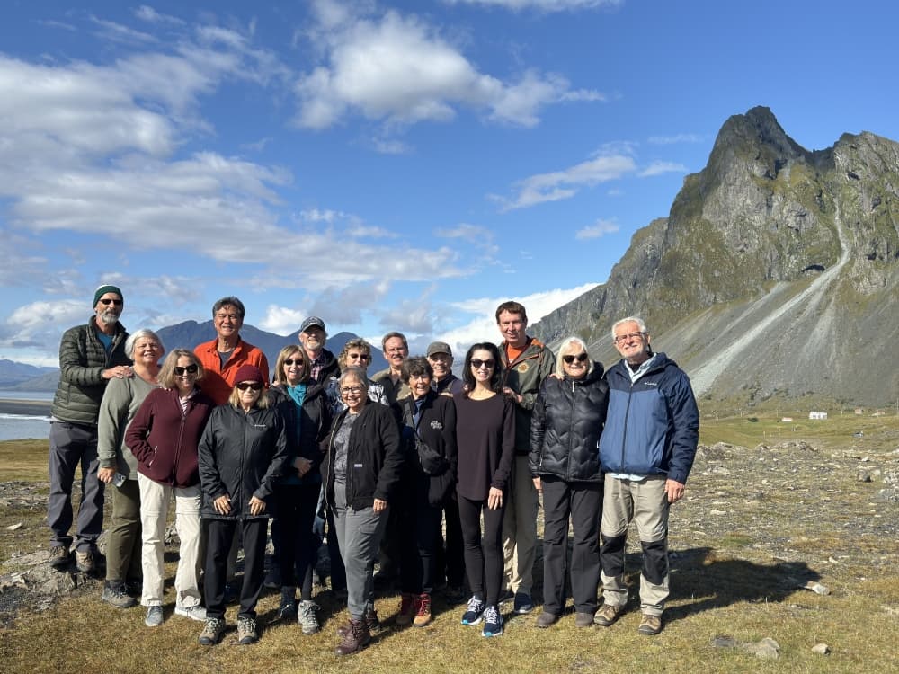 A group of people in an arctic mountain landscape