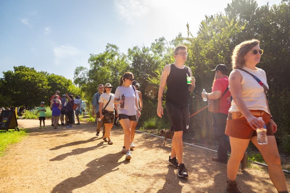 An image of people walking on the trail. 