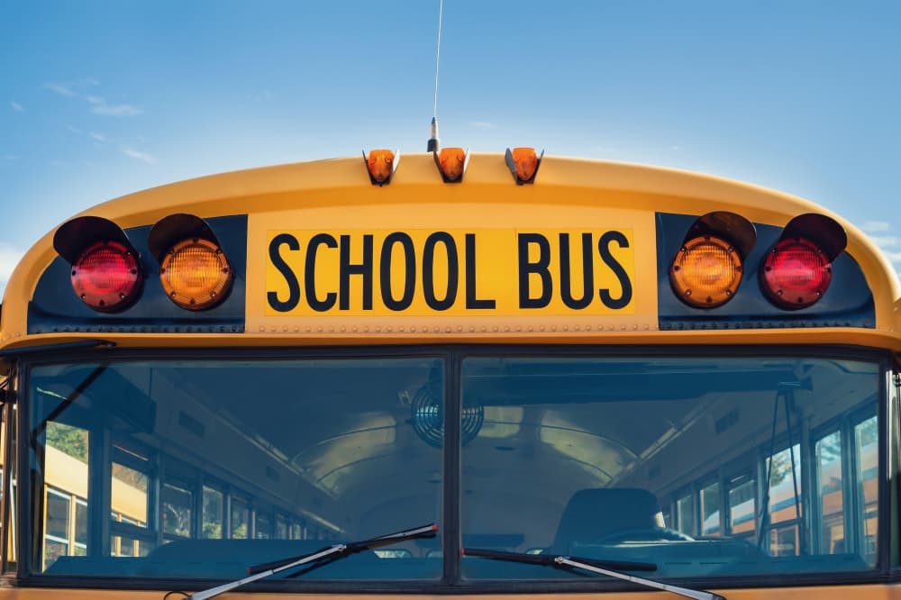 The top of a yellow school bus is shown.