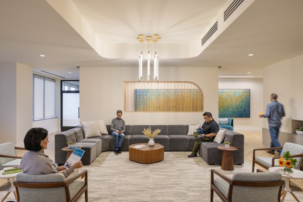 A waiting room area with people seated
