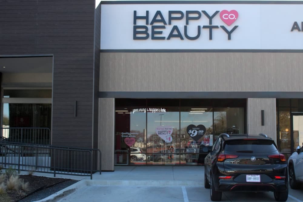 Exterior of building with Happy Beauty Co. signage. 