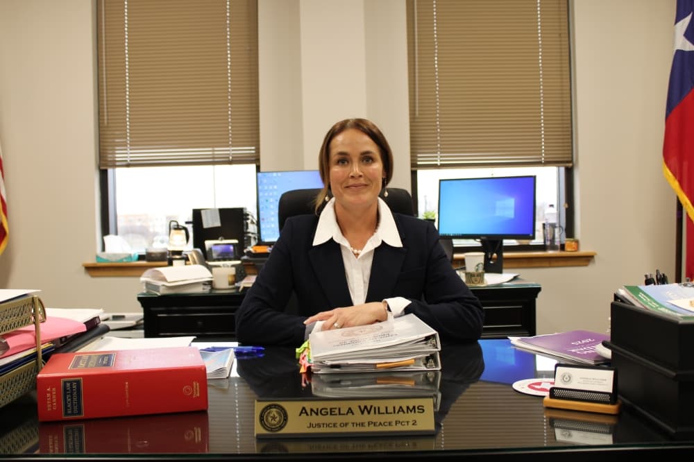 Judge Angela Williams poses at her desk in Cedar Park. 