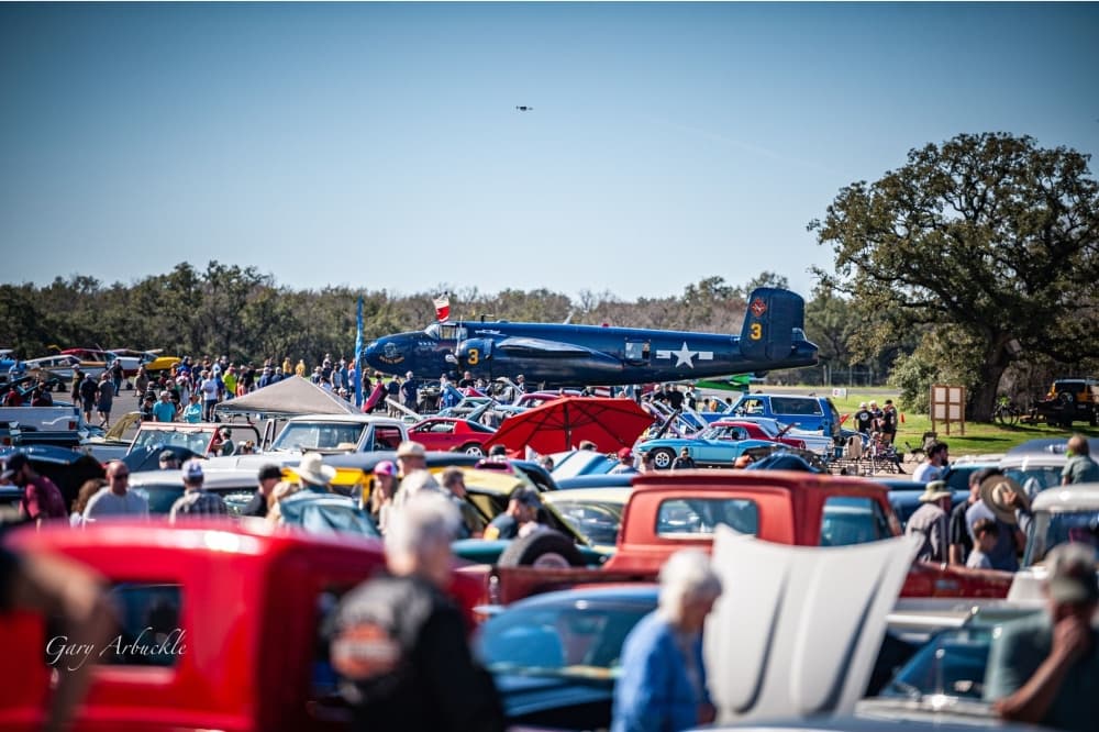 An image of a previous car and plane show. 
