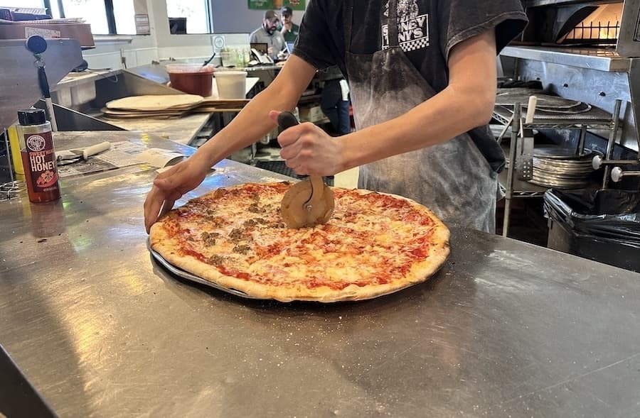 New York Pizza Pub offers customizable options with a variety of toppings. (Thalia Guzman/Community Impact)
