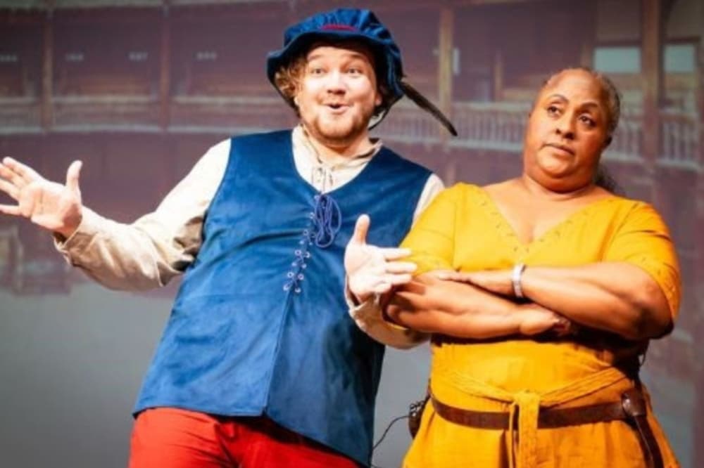 Two people dressed in costume perform during a show rehearsal.