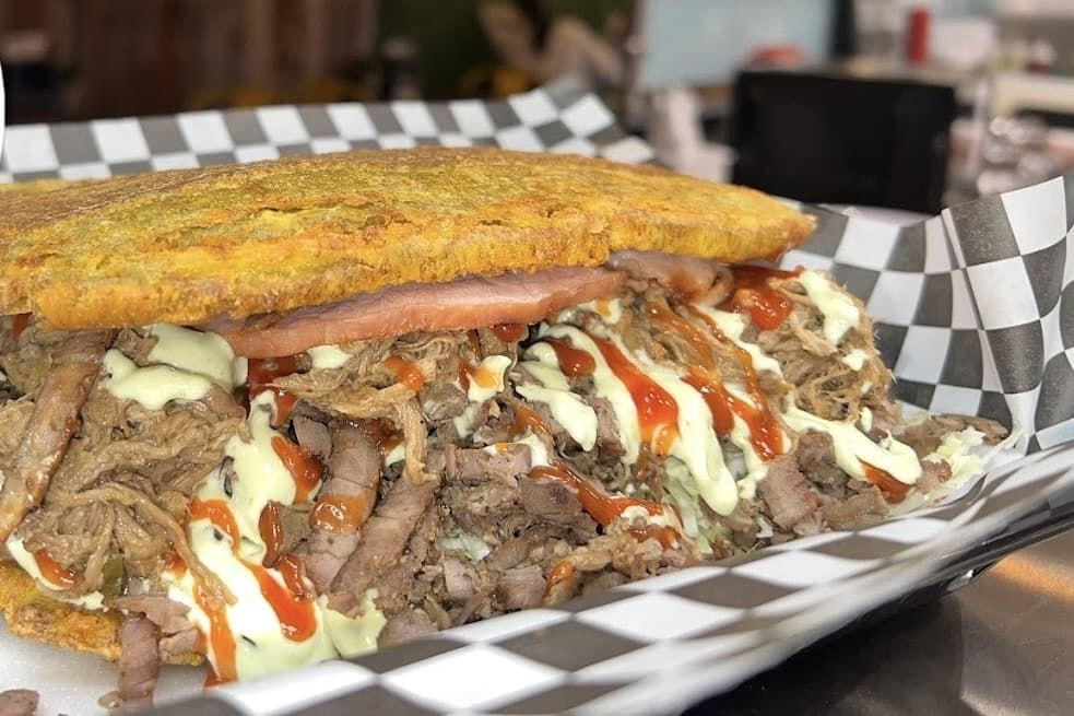 Sandwich with beef, cheese and sauce. 