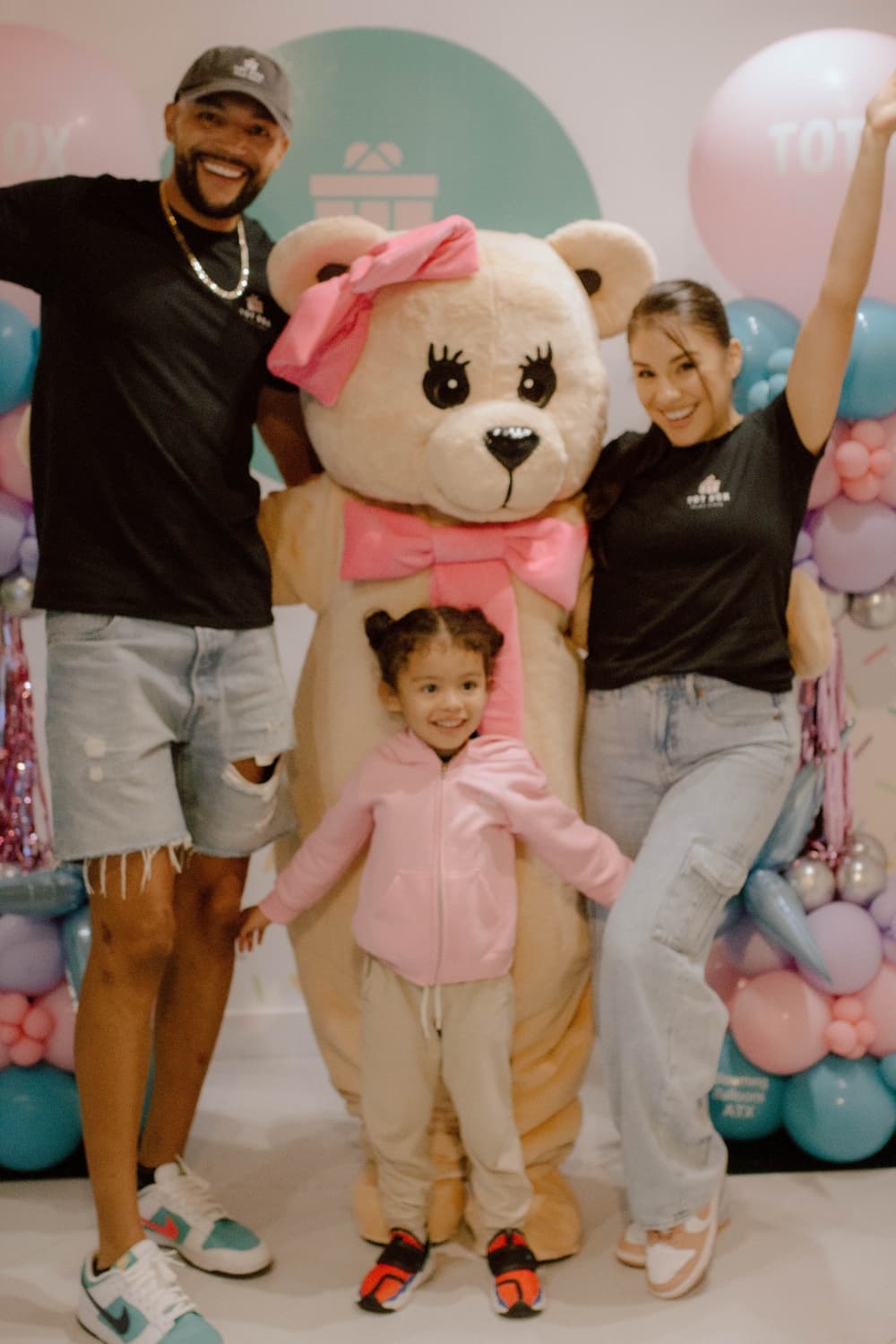 An image of the owner of the business with her husband and daughter. 