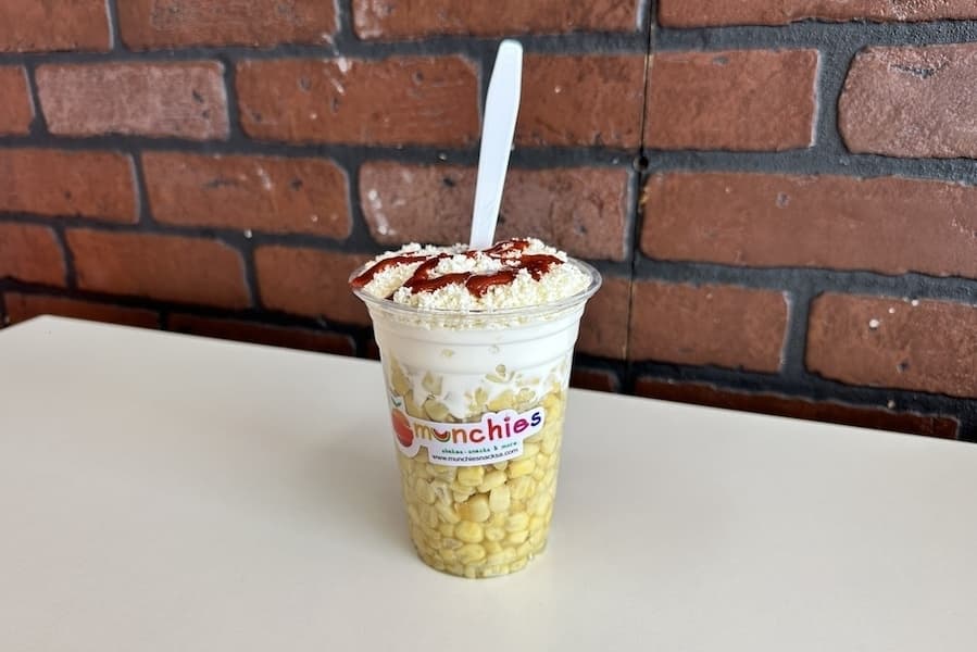 The corn in a cup ($5.50) has white corn, cheese, mayo and cream. (Thalia Guzman/Community Impact)