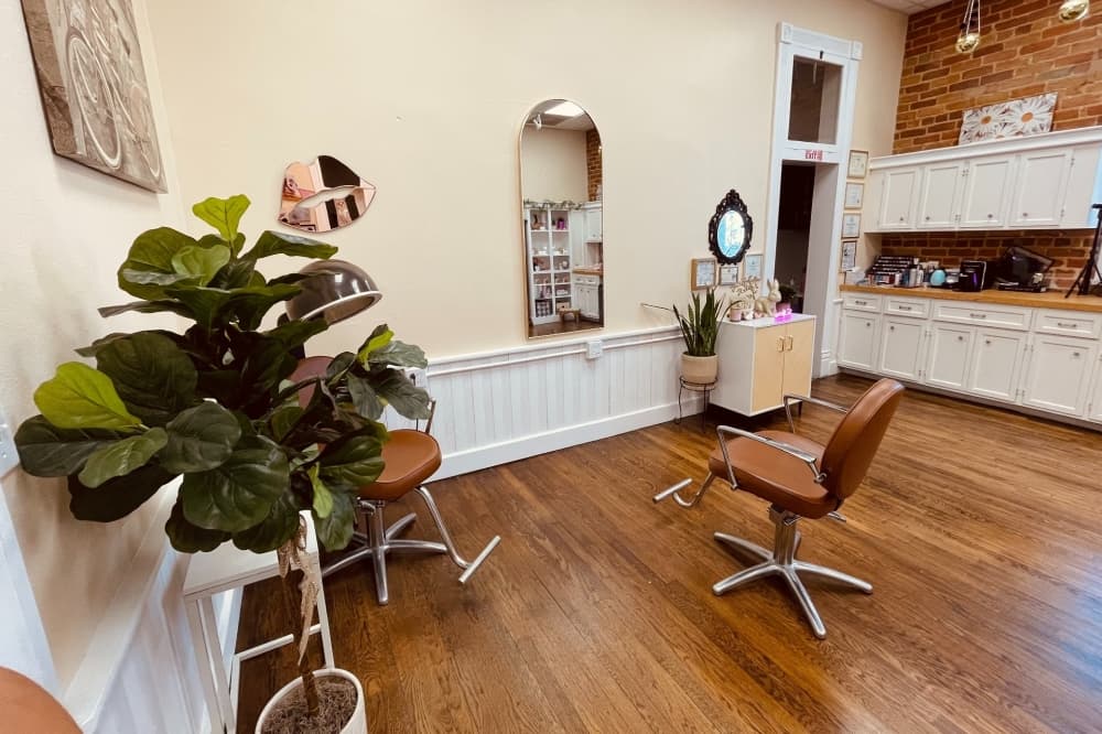 Woman standing inside hair salon