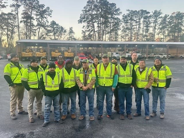 group of men in yellow vests