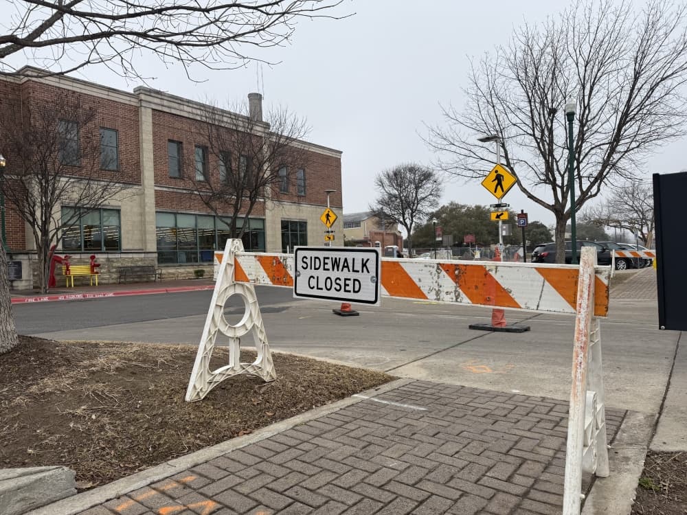 A sidewalk closed sign in downtown Georgetown. 