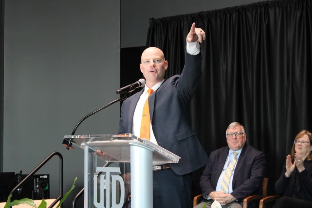 A man speaking at a podium