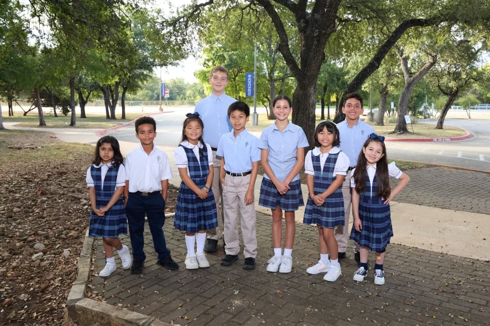 Students outdoors at a Catholic school.
