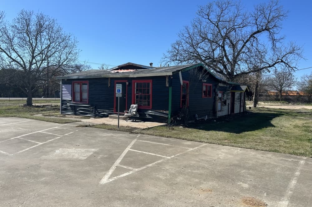 The exterior of a black building.