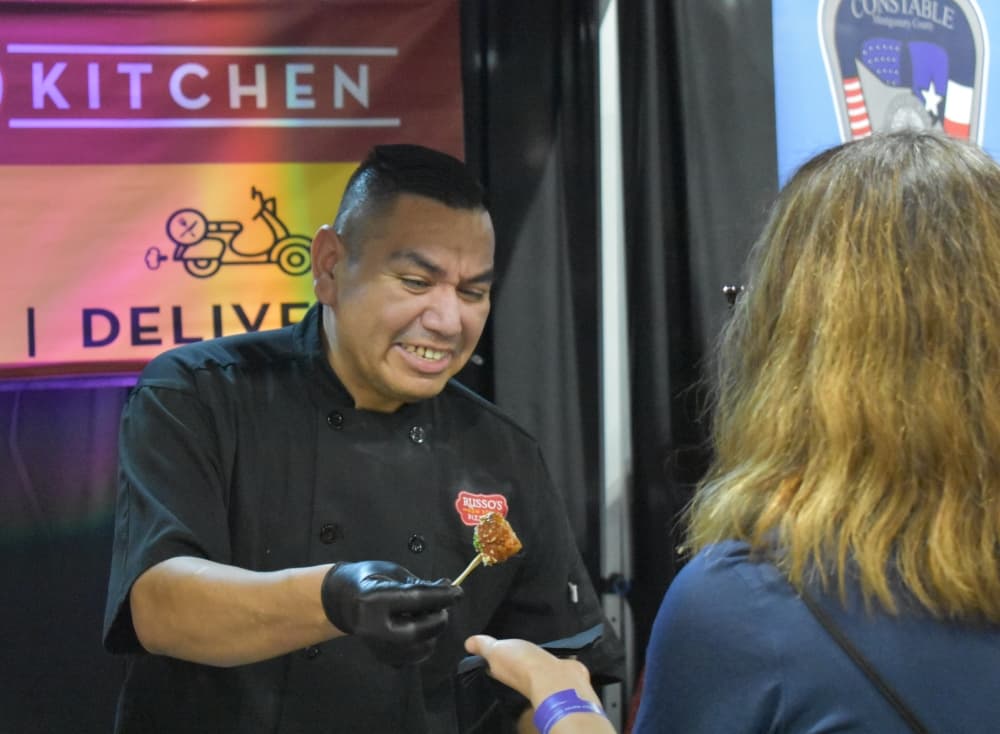 A man gives out food samples