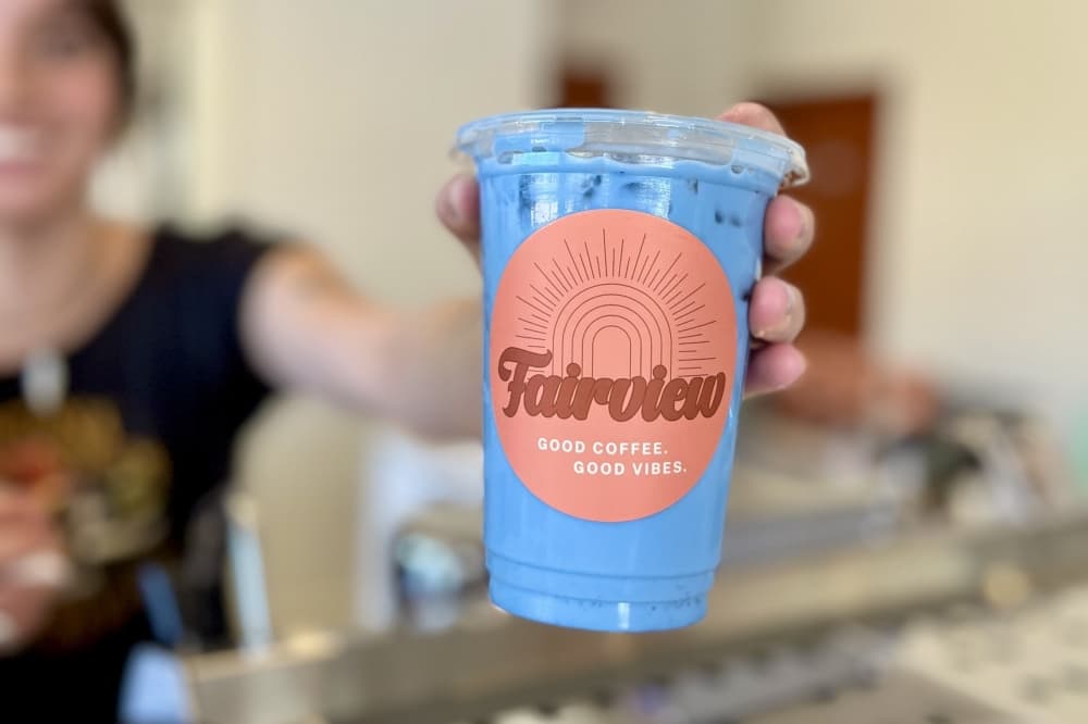 Photo of a purple drink in a cup that says the fairview
