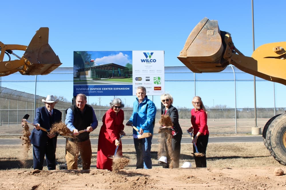 County and state officials pose for a groundbreaking photo. 